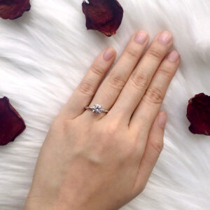 taking photo of engagement ring with rose background