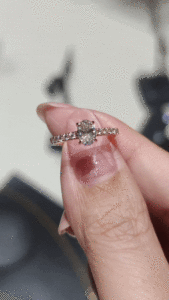 oval claw prong with diamond bridge engagement ring