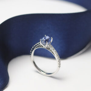 cornflower blue gemstone and pave diamond engagement ring