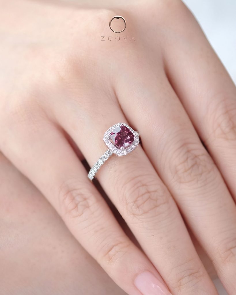 Cushion-cut reddish purple spinel gemstone ring with halo pave design in white gold
