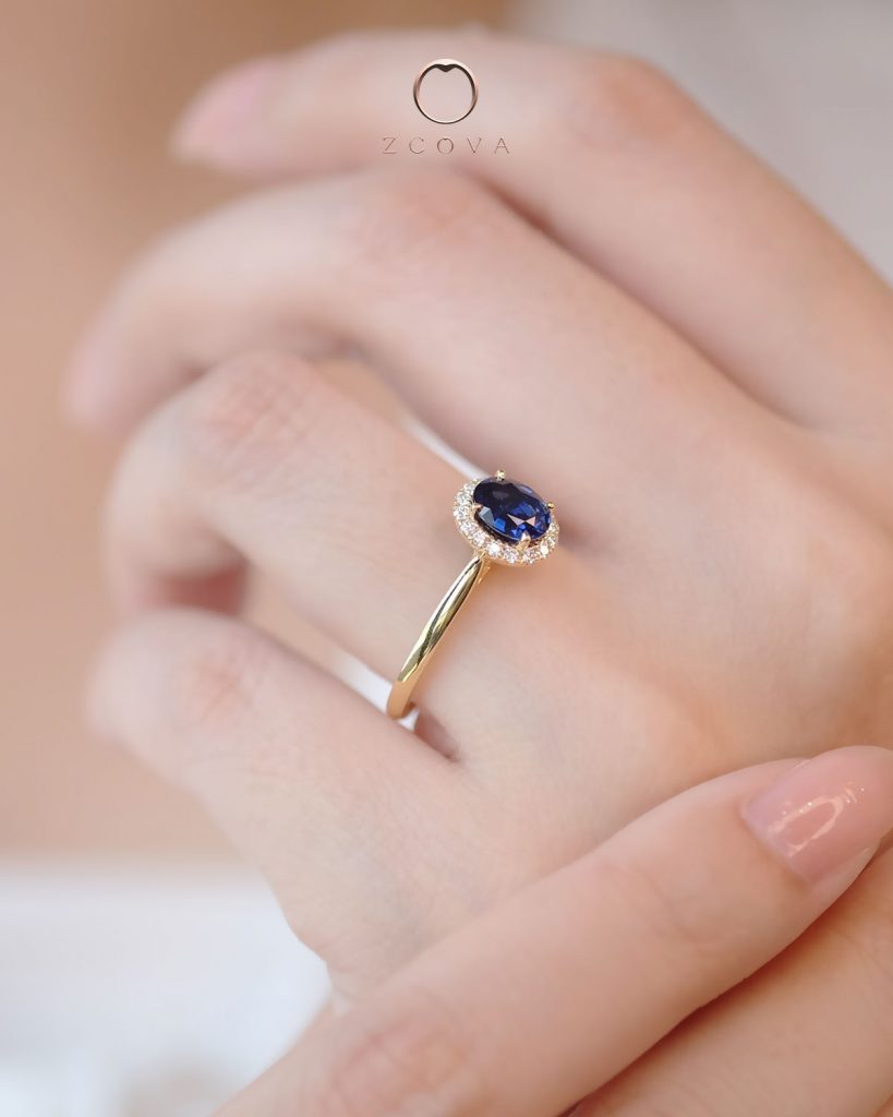 Oval Blue Sapphire Ring with simple Halo Design in Yellow Gold