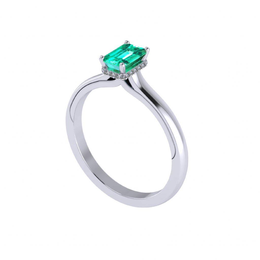 Emerald gemstone with hidden halo engagement ring