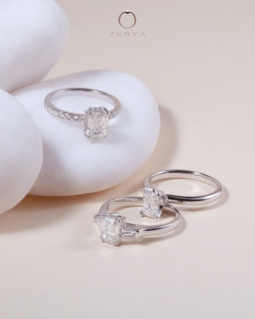 emerald and cushion cut diamond engagement ring
