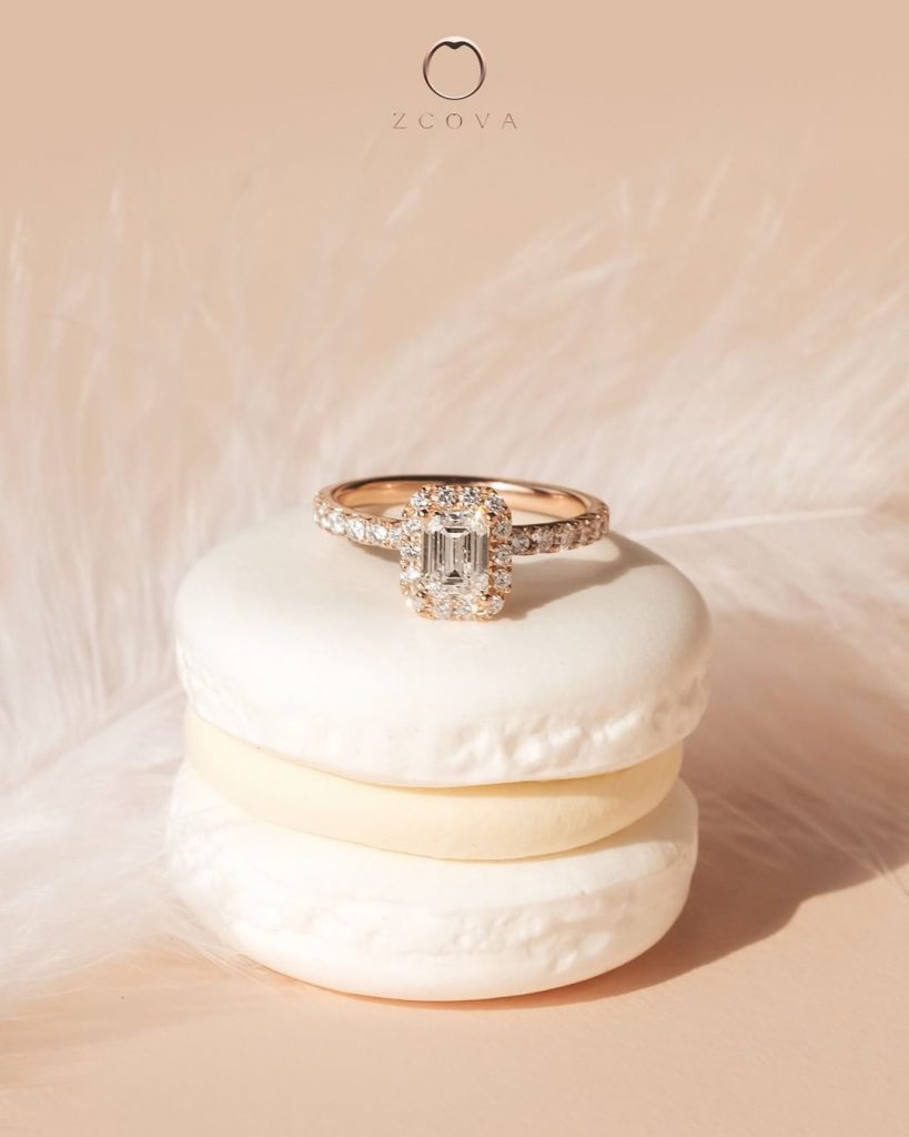 Emerald diamond halo engagement ring
