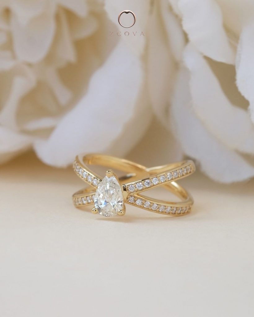 Pear-shaped diamond set onto a reverse split shank engagement ring