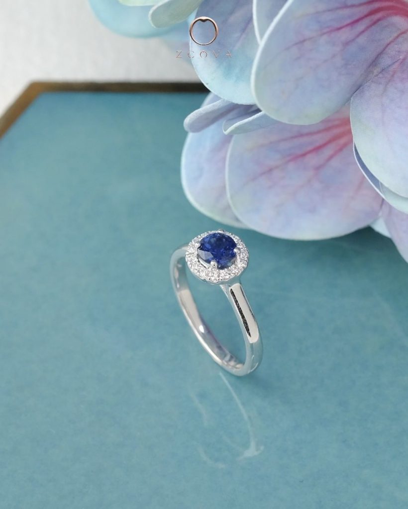 Round blue sapphire halo engagement ring