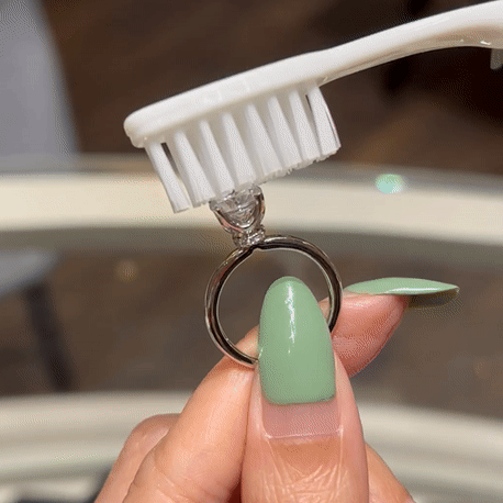 warm water and soft-bristled toothbrush to clean ring