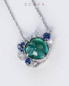 Emerald centre stone pendant with sapphire and diamond side stone necklace