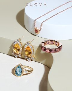 Collection of bespoke jewellery such as aquamarine and amethyst ring with citrine earrings and garnet birthstone necklace